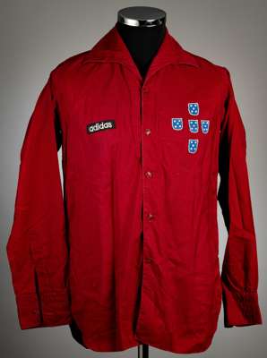 A very unusual dark red Portuguese no.11 football shirt, by Adidas,
 with retailers label for Fernando Peyroteo of Lisbon neck label, long-sleeved wit