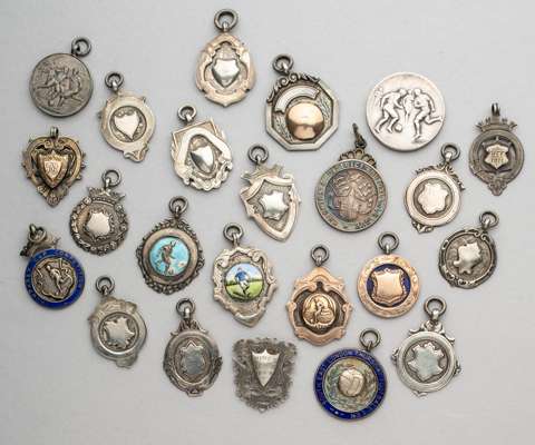 A miscellany of silver football medals,
 including one example in original case; five with gold mounting; four with enamelling; and 13 others, occasio