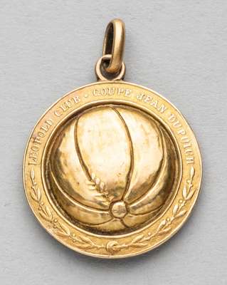 Leopold Club Coupe Jean Dupuich yellow metal medal, 
 modelled with a central football with a border of laurel leaves and LEOPOLD CLUB COUPE JEAN DUPU