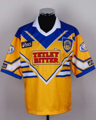 A yellow and blue Leeds Rugby league autographed shirt