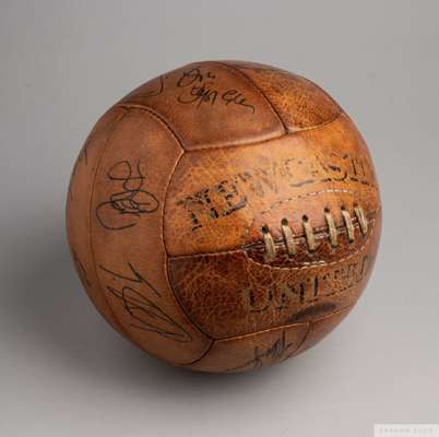 Brown leather Newcastle United autographed football
 bearing numerous autographs including Ivor Allchurch, Albert Scanlon, Bobby Ferguson etc and a co