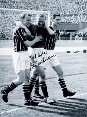 Great Wembley F.A .Cup final moment,
 Bert Trautman Manchester City goalkeeper is carried off the pitch by teammates after carrying on playing with a 