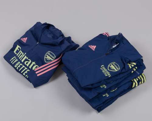 Twelve blue Arsenal training tops and jackets