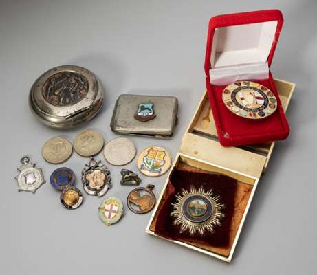 A white-metal Wembley Exhibition lapel badge, 
 another, pewter and enamel case with Wembley 1924 applied plaque, Football Association 1863-1963 ename