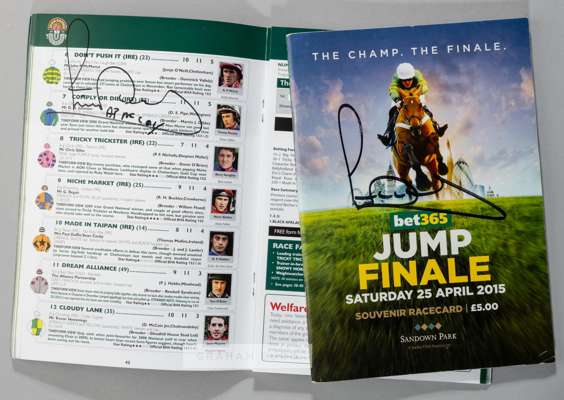 Sir Anthony McCoy signed race cards from the 2010 Grand National winning ride on Don't Push It at Aintree and his final day of racing at Sandown Park 