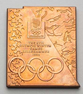 Lillehammer 1994 Winter Olympic Games participant's medal, 
 copper, 66 by 76mm, by M. Kleppan, pictograms of sporting events, ice crystals and Lilleh