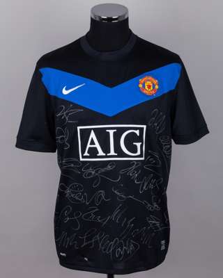 A Manchester United black and blue autographed short-sleeved shirt, 2010-11