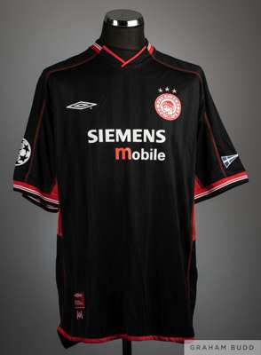 Athanasois Kostoulas black and red No.19 Olympiacos Champions League short-sleeved shirt, 
 Umbro, XL, with v-neck collar and embroidered cloth badge,