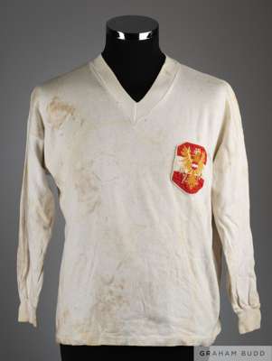 Norbet Hof white No.4 Austria v. Italy International long-sleeved shirt, 1970
 with v-neck collar and embroidered cloth badge, large areas of staining