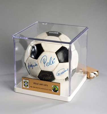 Pele-branded football signed by Pele and his 1970 World Cup team-mates Carlos Alberto & Jairzinho, mounted in a cubic Perspex display case with title 