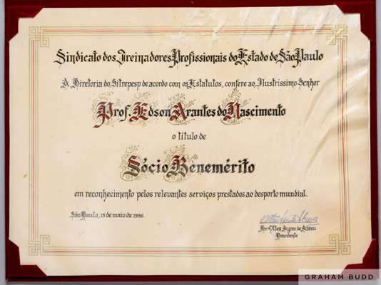 A paper "Meritorious Partner" certificate presented to Pelé by the President of the Union of Professional Coaches of the State of São Paulo.
 In recog