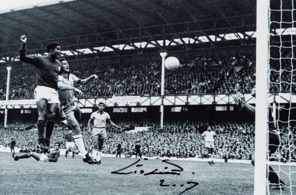 Eusebio signed photograph,
 8 by 12in. b&w portraying Eusebio in action during the 1966 World Cup at Goodison Park, signed in black marker