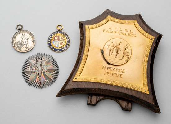 Four medal's and award's awarded to referee Henry Pearce,
 comprising The Football Association silver medal, obverse depicting a footballer and three 