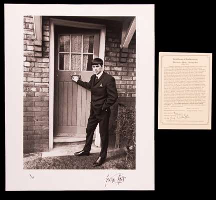 A George Best signed limited edition b&w photographic print,  16 by 20in. published by Popperfoto and printed from the original negative, numbered 8/2