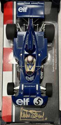 Sir Jackie Stewart (UK) signed 1/18 model car Elf Tyrrell Ford 006 signed by Jackie Stewart #5, winner of Monaco Grand Prix 1973,  
 signed in gold sh