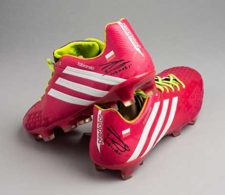 Arsenal and Poland's Lukasz Fabianski signed Adidas Predator football boots,
 pink and white football boots, each printed FABIANSKI with the Poland fl