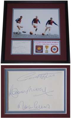 West Ham United and England 1966 World Cup winners Bobby Moore, Geoff Hurst and Martin Peters autographed, mounted & framed display, 
 features a phot
