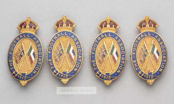 Four identical Football Association badges issued to F.A. official Charles James Hughes (1853-1916) for the Home International fixtures in 1910,
 all 