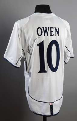 Michael Owen signed replica of his England 5 Germany 1 jersey, signed to the reverse in black marker pen; sold together with a Michael Own signed Engl
