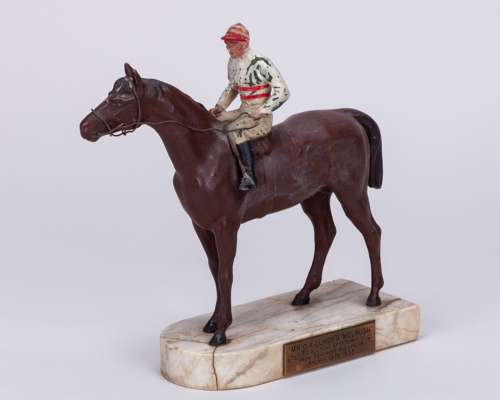 Painted spelter model of the racehorse ‘Melrush’ with jockey up dated 1933