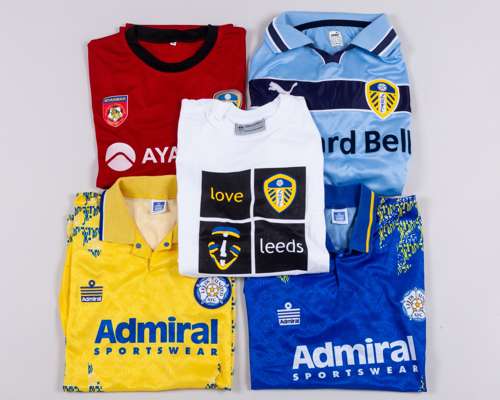 Four replica Leeds United shirts