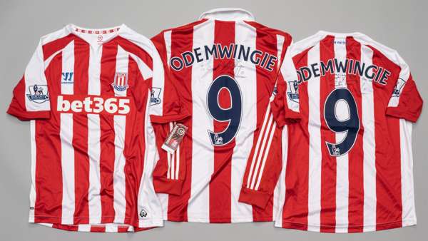 Three Peter Odemwingie signed Stoke City football jerseys,
 comprising red and white Stoke City no.9 jersey, season 2013-14, Adidas, long-sleeved with
