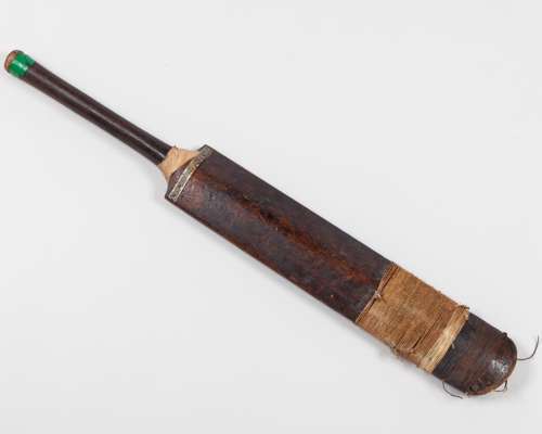A vintage Gardiner cricket bat, the back decorated with plaque inscribed Eric Hunston Walker