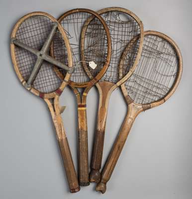Four wooden framed tennis racquets,
 two with fish tail handles circa 1900-1910, one by F.H. Ayres, the other named the "Vivid"; and two open throat r