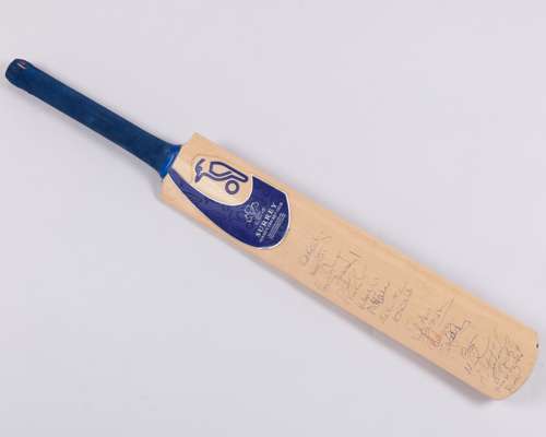 A Surrey County Cricket Club autographed cricket bat