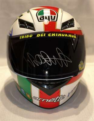 Valentino Rossi signed AGV-K3 Moto GP helmet “Rossi Icon”,
 the greatest ever Moto GP rider, this AGV K3 proudly displays your love of Valentino Rossi