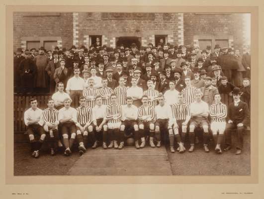 A large framed photograph of the Sheffield and Glasgow Representative Football Teams from the game that took place at Cathkin Park in 1899, taken by G