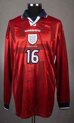 Richard Cooper red Umbro away no.16 jersey from the 1999 FIFA World Youth Championship Competition that took place in Nigeria.
 the jersey is a long s