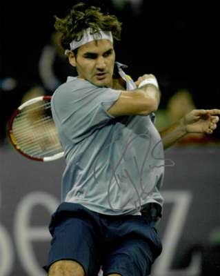 Roger Federer, The Greatest of All Time (GOAT) signed action 8 by 10in. tennis photograph,
 Signed in Silver marker. Federer has 20 Grand Slam Major w