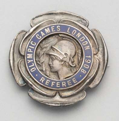 London 1908 Olympic Games Referee badge,
 the silvered bronze badge featuring the head of Athena surrounded by OLYMPIC GAMES LONDON 1908 REFEREE in a 