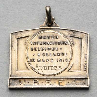 International friendly match Belgium v Holland referee's medal, played at Olympisch Stadion, Antwerp, 15th March 1914,
 obverse with a football match 