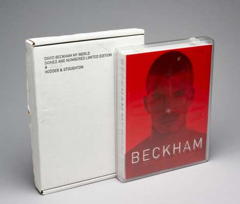 DAVID BECKHAM AUTOGRAPHED LIMITED DELUXE EDITION OF ‘MY WORLD’ NUMBER 243/1500 TO INCLUDE TWO LOOSE INSERTED IMAGES IN THE ORIGINAL CLIP CASE, 
 STILL
