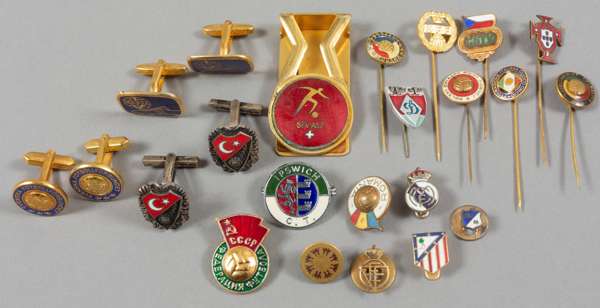 A group of football badges originally owned by Sir Alf Ramsey,
 including Romania, USSR, Portugal, Sweden, Czechoslovakia, East Germany, Poland, Turke