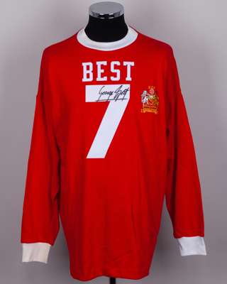 A red replica No.7 autographed George Best shirt