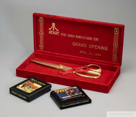 A pair of gold tone metal scissors presented to Pelé by Atari Manufacturing. 
 Pelé used these scissors in the ribbon-cutting ceremony at the grand op