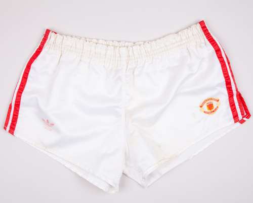 A pair of white and red Manchester United shorts, 1983-84
