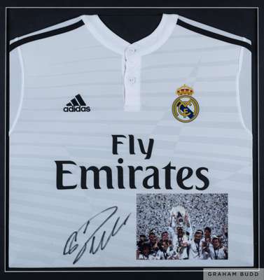 Ronaldo framed signed Real Madrid shirt, 
 Adidas, crew neck and signed in black pen with a photographic insert of Ronaldo and his team mates lifting 