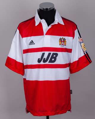 A red and white Wigan autographed rugby league shirt