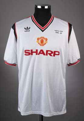 Kevin Moran white, red and black No.6 Manchester United match worn short-sleeved jersey, 1984-85, 
 Adidas, L, with v-neck collar and embroidered badg