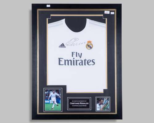 A Cristiano Ronaldo autographed white Real Madrid replica shirt display