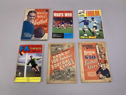 A collection of football albums and pocket guides including Who's Who in Football, 1934, Tiger Album of Football Badges, Football Weekly, 650 Football