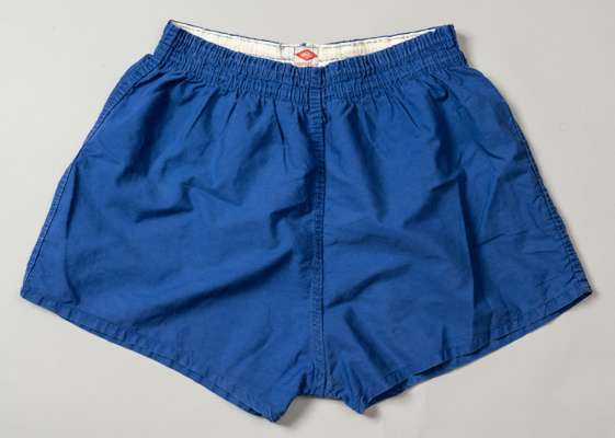 Pair of blue Nobby Stiles worn England shorts, 
 with Umbro Stayput waist World Cup 1966 label, All Cotton 36/38"

 Tommie Hamilton came to Manchester