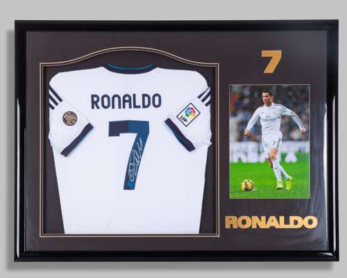 Cristiano Ronaldo autographed white and Real Madrid replica short-sleeved shirt display