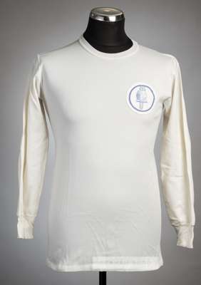 White Leeds United no.8 home jersey, mid 1960s,
 long-sleeved with printed club crest badge, reverse numbered 8 in blue felt, no makers label