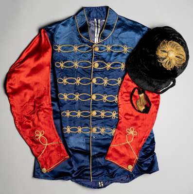 A set of racing colours of HM King George VI originally in the training yard of Noel Murless at Beckhampton circa 1948,
 purple jacket, scarlet sleeve