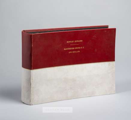Duncan Edwards' family photograph album for his Manchester United and England football career,
 the high quality album in red and white leather cloth 
